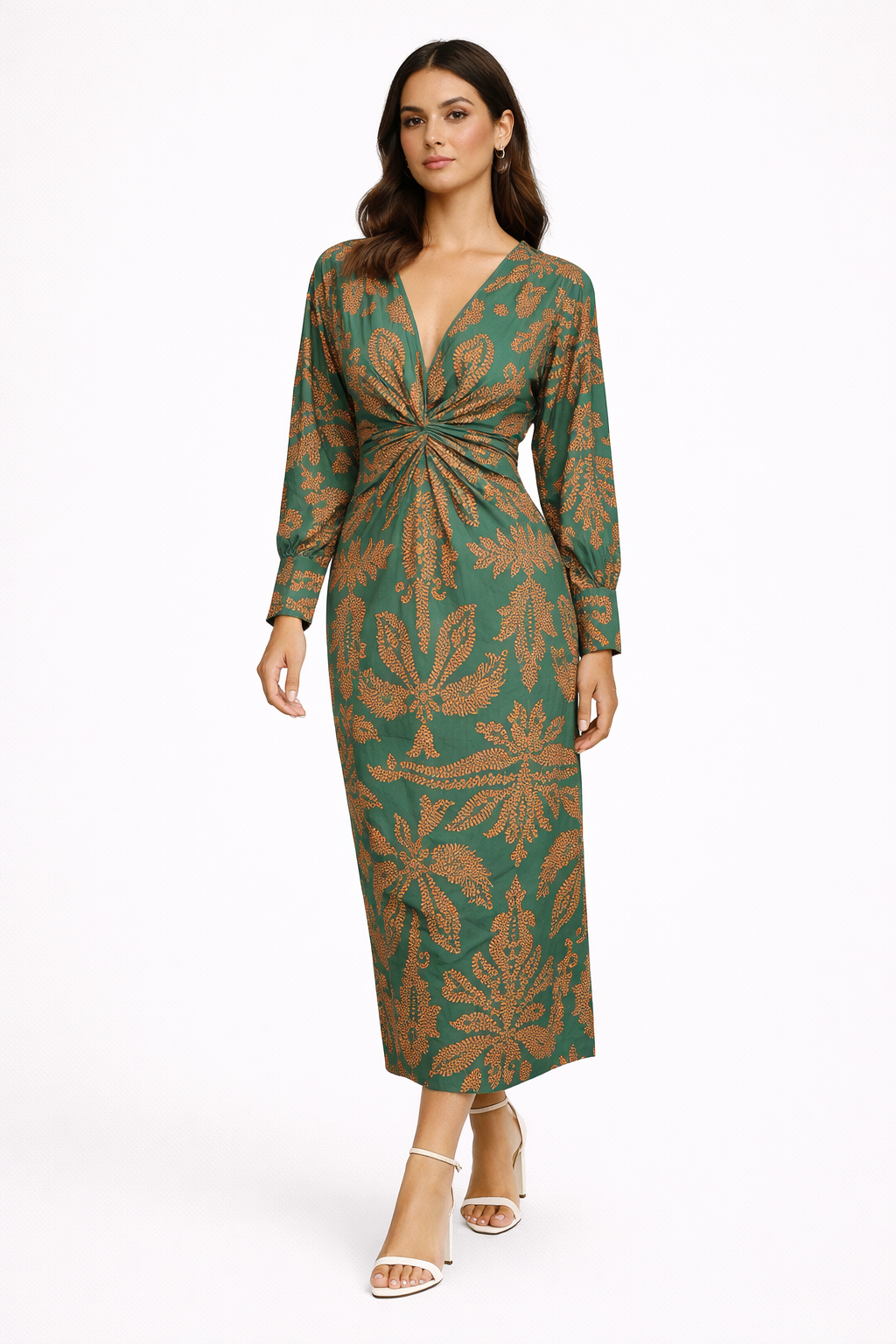 Woman wearing a green and brown patterned dress on a white background