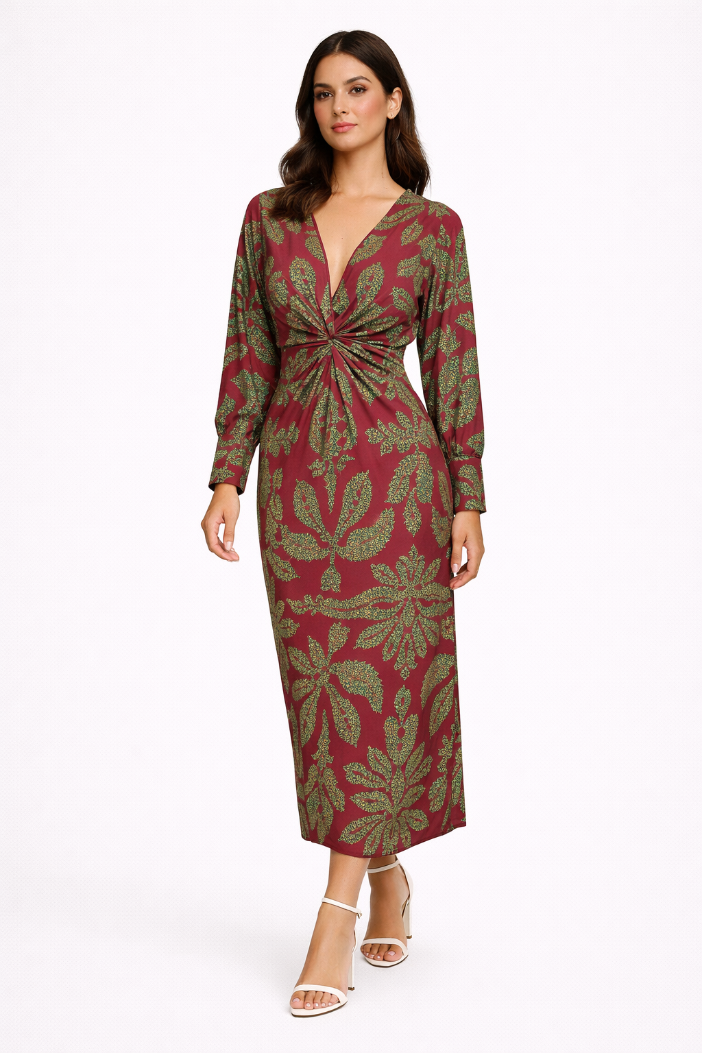 Woman wearing a burgundy dress with green leaf pattern on a white background