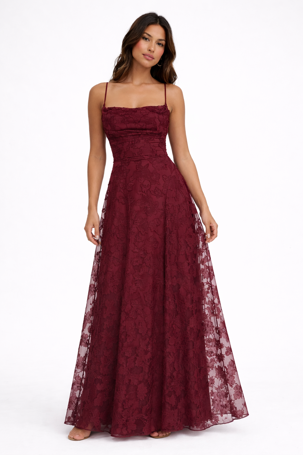 Woman wearing a claret lace dress on a white background